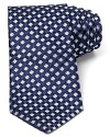 Brilliant toned silk tie covered in an eye-catching box pattern.