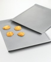 Bake gooey chocolate chip or moist oatmeal raisin cookies with this medium cookie sheet. Features include nonstick interiors and exteriors for easy cleaning, no-hassle food release and optimum baking performance. Reinforced nonstick surface also offers long-lasting durability. Constructed of aluminized steel to resist rusting. Rolled edges are reinforced with tinned steel wire for added strength. Flat edges allow food to slide off from pan to plate without utensils. Oven safe to 450 degrees. Lifetime warranty. Model BW1415.