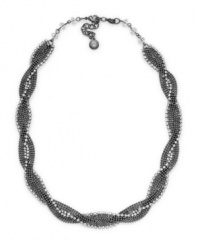 Tie your look together in classic style with a twist. Alfani necklace features braided hematite tone mixed metal accented with sparkling crystals. Approximate length: 17 inches + 2-inch extender.