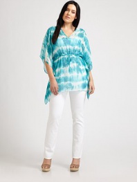 Explore your inner bohemian with this tie-dye tunic featuring flowing, kimono sleeves and a figure-defining, Empire waist. V-neckKimono sleevesDrawstring waistAbout 31 from shoulder to hemPolyesterMachine washImported