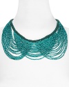 Color pop your way to cool with this beaded bib necklace from Aqua, accented by cascading green and turquoise beads. It's the piece we want bright now.