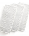 Grab style and keep function with a set of three kitchen towels that step forward in eye-catching color to wipe up spills, aid in prep and add an accent to your space. The textured design sets a sharp appearance for any room, while the highly absorbent terry quickly cleans up. Limited lifetime warranty.