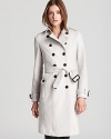 This iconic Burberry London trench coat is rendered in rich wool and features finely appointed details like designer-embossed buttons, military-inspired epaulets and a signature check lining. Refined enough for the workday, but chic enough for evening-this is the fashion investment your winter wardrobe has been wanting for.