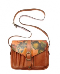 Buttery soft Italian leather with a floral print, antique brass hardware and burnt edges define the Praga purse by Patricia Nash.