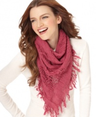 Let fashion be the window to your soul. Laid-back and lovely, this airy triangle scarf by Echo features worn patches.