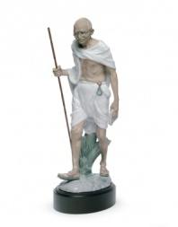 An homage to political activist and revered philosopher Mahatma Gandhi, this elaborate Lladro collectible depicts the historic figure in artfully glazed porcelain.