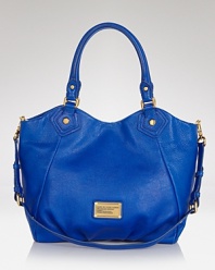 MARC BY MARC JACOBS's signature leather tote is recast for fall in a cool blue hue. Channel your inner ROY G. BIV and carry this saturated style as an on-trend alternative to the basic black bag.