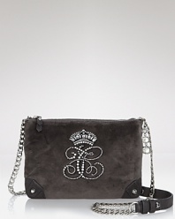 Size down and glam up with this lush, velour crossbody bag from Juicy Couture, punctuated by leather straps and rhinestone detailing.