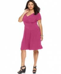 Look slender and sensational with Elementz' short sleeve plus size dress, featuring a flattering crisscross front and slimming panel-- wear it from day to play!