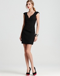 An asymmetrical peplum adds interest to this Black Halo dress--a chic, modern twist on the classic LBD.
