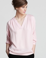 This DIANE von FURSTENBERG blouse lays on the feminine charm with a candy-colored hue and billowy silhouette.