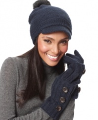 Snug as a bug and cute to boot! Warm your ears with this close-fitting knit cap by Nine West featuring a faux fur pom pom and short brim.