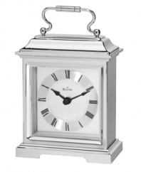 This formal carriage clock by Bulova adds elegance to an end table or side board. Rectangular spun and brushed aluminum case features a curved handle at top. Silver tone dial displays black Roman numerals and two hands.