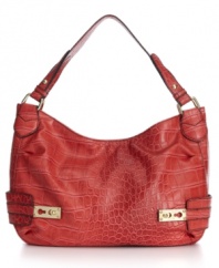 Slouchy, sexy, so-now: this patent croc-embossed hobo bag from Jessica Simpson is high on shine and style.
