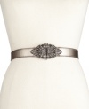 Let the light shine in with this shimmery leather belt from Fossil. Graced with a scrolling metal clasp encrusted with rhinestone embellishments.