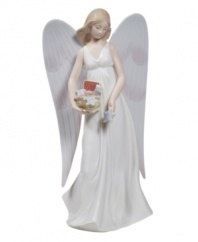 Stunningly crafted in smooth porcelain, this lovely angel from Lladro stands tall atop your tree to shower your home with peace and goodwill.