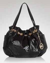 MICHAEL Michael Kors' luxe take all-American style proves casual with this roomy straw tote. Whether as a beach bag or at-work carryall, this bag has a practical ring to it.