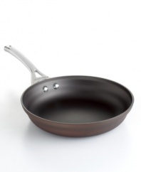 Just right. The perfect kitchen companion, this elegant bronze piece features multiple layers of nonstick technology, a hard-anodized construction and stay-cool handles for an unrivaled combination of professional performance and everyday ease. Your go-to for making frittatas, omelettes, pasta, sauteed seafood and so much more. Lifetime warranty.