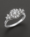 White gold diamond flower cluster ring. With signature ruby accent. Designed by Roberto Coin.