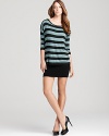 This Bailey 44 dress boasts a cool two-in-one look with a boldly striped top layered over an ultra-fitted skirt.