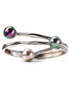 A chic bangle with three overlapping pearls on bands of sterling silver with pave stone accents. Designed by Majorica.