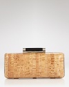DIANE von FURSTENBERG's cork-print leather clutch makes every evening look pop. On holiday, this textured pick up looks retro-resort with a maxi dress, platforms and oversized frames.