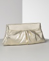 Lauren Merkin Eve textured lambskin leather clutch is undeniably modern and chic. Pleated detail for textural interest. Opens to a hexagonal frame and secures with a hinge closure. Interior zip pocket. Signature pink striped shimmer lining.