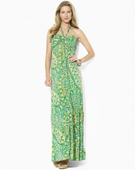 A vibrant sweeping pattern enlivens a breezy maxi dress, rendered in sleek jersey with a halter neckline.