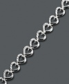 The perfect gift for a special loved one. Victoria Townsend's adorable heart link bracelet highlights sparkling, round-cut diamonds (1/4 ct. t.w.) set in sterling silver. Approximate length: 7 inches.