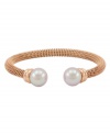 Lovely and luxurious. Crafted in rich rose gold tone stainless steel, Majorica's beautiful bangle bracelet is enhanced by organic man-made pearls. Wear it anytime you want to add extra elegance to your look. Approximate diameter: 2-1/2 inches.