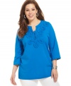 Crafted applique beautifully accents Jones New York Signature's three-quarter sleeve plus size tunic top for a chic casual look.