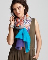 A variety of vibrant floral pattern circles decorate this stylish scarf from Inoui.