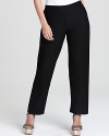 Eileen Fisher stretch crepe pants in plus size are straight leg with covered elastic waistband. Slips on over hips. Darts at back of pant.