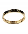 Add versatility with a subtle slip-on layer. AK Anne Klein bracelet features a gold tone mixed metal setting and accents that highlight a shiny, jet black enamel surface. Bracelet stretches to fit wrist. Approximate diameter: 2-1/2 inches.