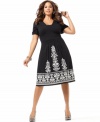 An empire design lends a flattering fit to INC's short sleeve plus size dress, accented by embellished embroidery.