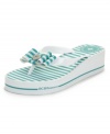 A fun twist on your summer shoes. The Fancie flip flops by BCBGeneration mix it up with stripes, bows and a wedge heel.
