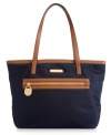 The petite version of it's big sister, this go-anywhere Kempton tote from MICHAEL by Michael Kors is perfect for any outing. Signature 18k gold signature hardware dress up the casual nylon design, while the organized interior features plenty of pockets to safely stow all the essentials.