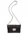 Diamond-quilted in super-soft lamb leather, this convertible purse by Calvin Klein turns heads (and turns into a clutch).