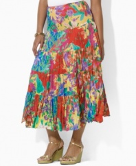 Airy, crinkled cotton lends casual elegance to Lauren by Ralph Lauren's flowing plus size maxi skirt, constructed in a tiered silhouette with a vibrant floral print for exotic glamour.