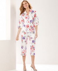 Snuggle up in a pretty springtime print. Morgan Taylor's ruffle top and pants pajama set features quarter-length sleeves and capri pants.