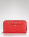 For the fashion fiend with a practical side, MARC BY MARC JACOBS' zip-around leather wallet is an uncommonly cute spot to stow cards, cash and cents.