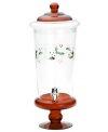 Etched and painted with a festive pattern of holly and berries, this red-stemmed Winterberry beverage dispenser by Pfaltzgraff makes a merry impression at the holiday buffet table.