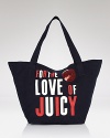 Be a love generation with Juicy Couture's graphic canvas tote. For the girl who never shies from a statement, this roomy tote makes it.