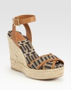 Uptown-chic espadrille silhouette has an adjustable leather ankle strap and soft straps in a modern geometric pattern. Braided hemp wedge, 5 (125mm)Braided hemp platform, 1 (25mm)Compares to a 4 heel (100mm)Leather and fabric upperRubber solePadded insoleImportedOUR FIT MODEL RECOMMENDS ordering true whole size; ½ sizes should order the next whole size up. 