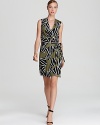 DIANE von FURSTENBERG puts a fresh spin on her iconic wrap dress with a sleeveless silhouette and extra-bold print.