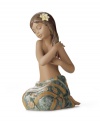 Lladro captures a different type of beauty from the South Pacific in this handcrafted porcelain figurine. With a pretty wrap skirt and flower in her hair, she's the picture of serenity.