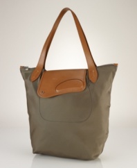 Channeling timeless style in a classic silhouette, this chic tote in lustrous, durable nylon is finished with supple cowhide leather accents for a heritage touch.