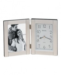 Keep time and memories close to your heart with this elegant picture frame and clock by Bulova. Hinged brushed aluminum case with picture frame at left and clock at right. Dial features black numerals, two black hands and gold tone second hand.