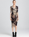 A painterly print adorns this artfully constructed Helmut Lang jersey dress with wrap-style skirt.