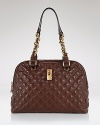 Classic quilted leather meets it's match in a structural silhouette in this ultra-chic satchel style from Marc Jacobs.